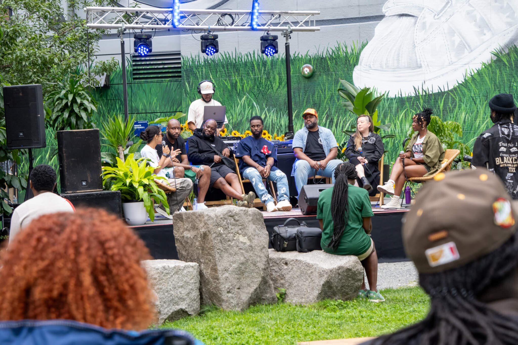 Image of the panelists sitting down together